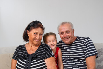 Portrait of a senior with their great-granddaughter
