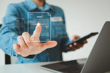 E-signing, electronic signature, document management, paperless office. Businessman signing on e...