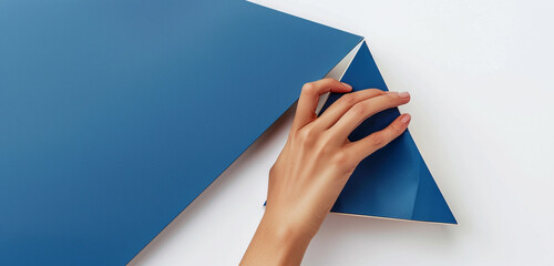 Woman's hand exhibits a unique and striking cobalt blue triangular cream mockup.