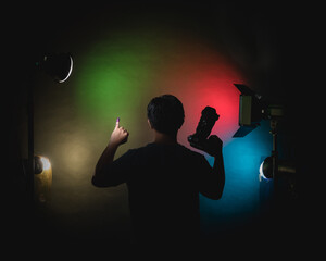 hand with finger pointing ; hand with purple ink ; indonesia election ; pinky finger with ink ;...