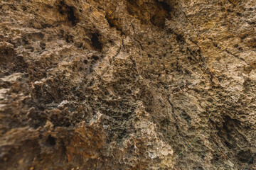 Stone texture on the beach during sunny day