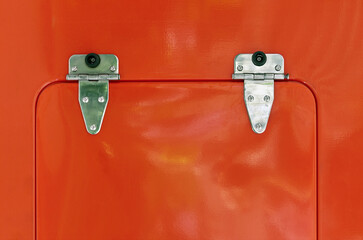 red fire truck detail. door. side view of fire engine.