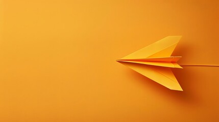 Orange colored paper plane is flying to the right on orange colored background