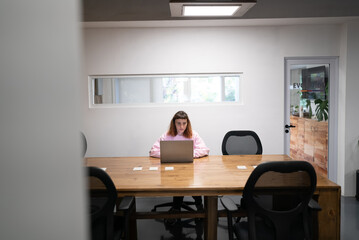 Businesswoman Using Computer in Modern Office. Stylish Beautiful Manager Smiling.  Happy Beautiful Worker.