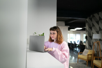 Businesswoman Using Computer in Modern Office. Stylish Beautiful Manager Smiling.  Happy Beautiful Worker.