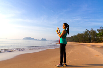 Woman walk exercise morning at beach