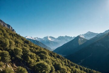 Obraz premium Beautiful serene mountain landscape with a clear blue sky.