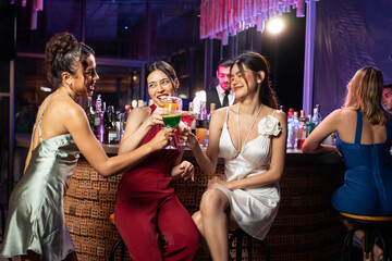 Asian beautiful women having fun, meeting each other in bar restaurant. 
