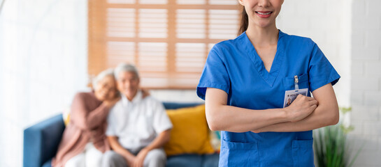 Close up of Asian beautiful caregiver take care senior couple in house. 