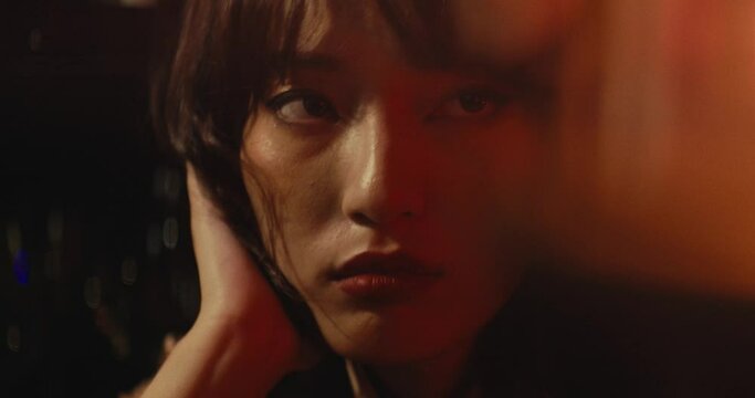 close up portrait of a asiatic female young model girl with male up feeling sad and alone