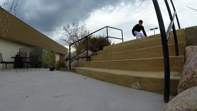 skateboarder does a back side heel flip