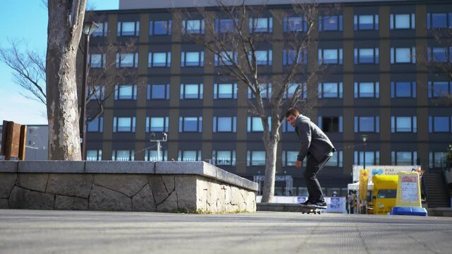 japanese skateboarder does a trick on their skateboard
