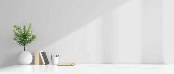 Clean white desk with a laptop, a small potted plant, and a notebook, minimalist workspace, white background