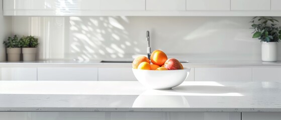 Minimalist white kitchen with a single bowl of fruit on the counter, clean and modern design, bright natural light