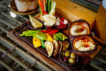 Mezze Plate. Whit Hummus, Olives, Crudites, Pita Bread, Baba Ghanoush. Various appetizing spanish mezze dishes.