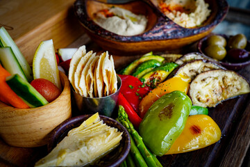 Mezze Plate. Whit Hummus, Olives, Crudites, Pita Bread, Baba Ghanoush. Various appetizing spanish mezze dishes.