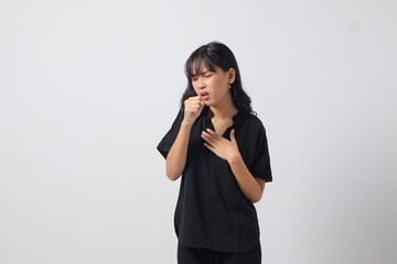 Portrait of attractive Asian woman in casual shirt suffering with cough and feeling unwell. Businesswoman concept. Isolated image on white background