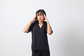 Portrait of overwhelmed Asian woman in casual shirt touching her head, having headache, and feeling stressed. Businesswoman concept. Isolated image on white background