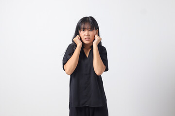 Portrait of attractive Asian woman in casual shirt making shocked hand gesture, showing surprised and scared expression. Isolated image on white background