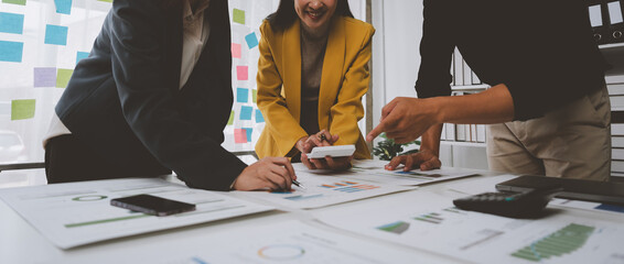 A team of young Asian entrepreneurs had a small team meeting. For upcoming projects in online...