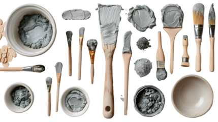Grey modelling clay sculpture with modelling tools isolated on a transparent background
