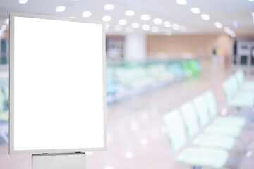 A mockup of an empty white poster on the wall in modern hospital waiting room with comfortable...