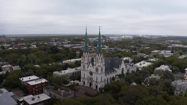Descending close-up aerial shot of the historic Cathedral Basilica of Saint John the Baptist in Savannah, Georgia. 4K