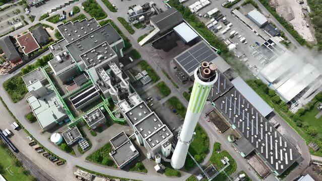 The Asdonkshof waste incineration plant in Kamp Lintfort. Thermal waste treatment and recycling. Combustion of waste, converted into new energy. Industrial installation. Aerial drone view.