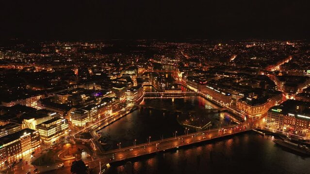 Aerial view of Geneva's streets at late night, highlighting the lights and water reflections on lake Geneva