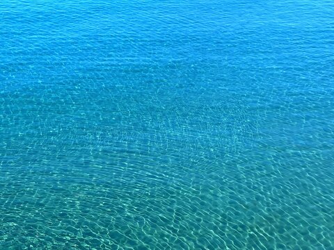 Blue sea water surface calm clear aqua background