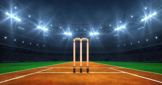 Modern sport stadium at night and cricket field with wicket ready for the match. Professional 4K video loop for sports advertisement.	