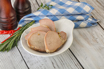 Baked pork tenderloin served rosemary
