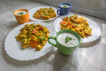 Chicken stewed with vegetables and kefir with chives.