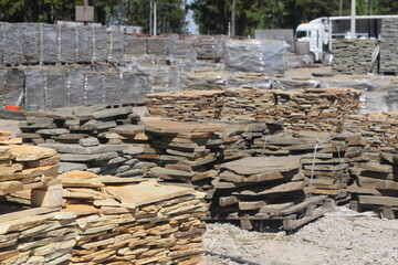 trade in natural stone in the open air, stone in stacks and heaps, stone for landscaping for sale 2