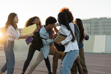 A diverse group of young adults interacting, fighting, bullying at school,