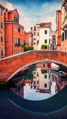 Bright spring view of Vennice with famous water canal and colorful houses. Splendid morning scene...