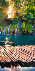Picturesque morning view of Plitvice National Park. Colorful spring scene of green forest with pure...