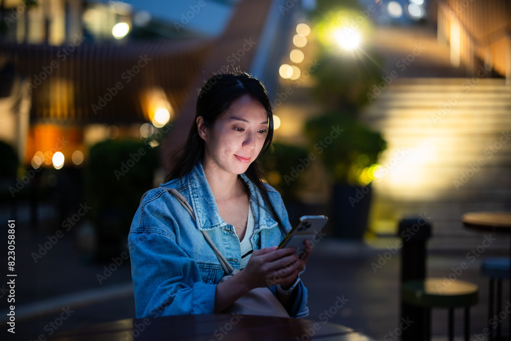 Canvas Prints woman read on smart phone in city at night