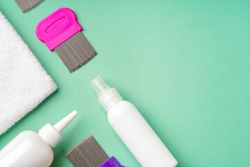 Anti lice equipment on green background top view