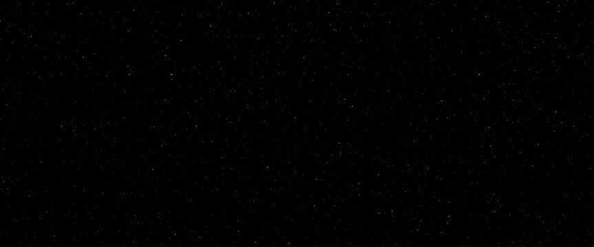 Flying dust particles on a black background, abstract real dust floating over black background for overlay, night sky graphic resources star on snow effect background	