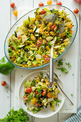 Healthy mexican chopped salad on white table background