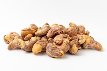 Shelled cashew nuts on white background