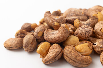 Shelled cashew nuts on white background