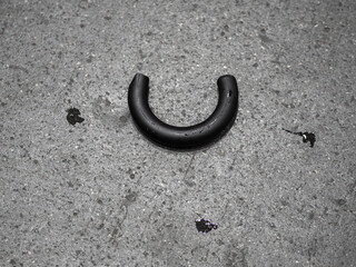 Rubber tubing of umbrella handle on concrete