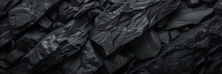 Black rocks on a black textured background , texture on rock wall,black rocky surface,Black rock texture with cracks. dark Rough mountain surface. dark Stone granite. banner