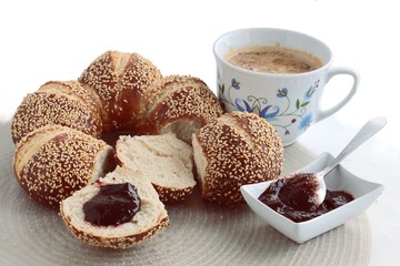 tasty bread with seeds and cup of coffe for breakfast