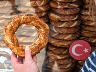 Istanbul, Turkiye - 05 05 2024 : Street vendor selling Simit, a bagel-type bread roll, a Turkish specialty.