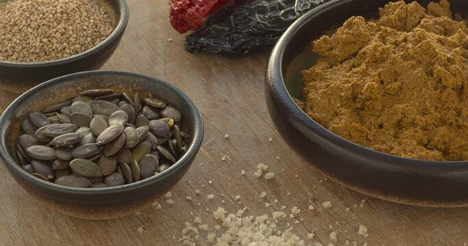 Homemade vegan Mexican sauce Pipian Tlatonile. The sauce's main ingredients are sesame seeds, pumpkin seeds, dried chilies, olive oil, and salt. Table spin.