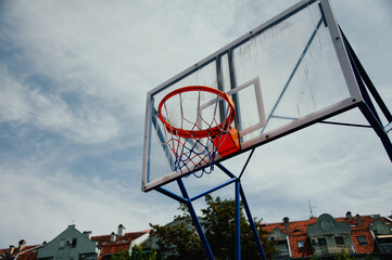 basketball hoop in a city landscape