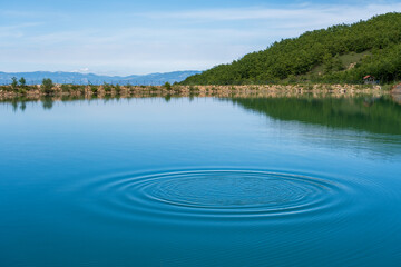 a lake with gentle ripples on the water's surface